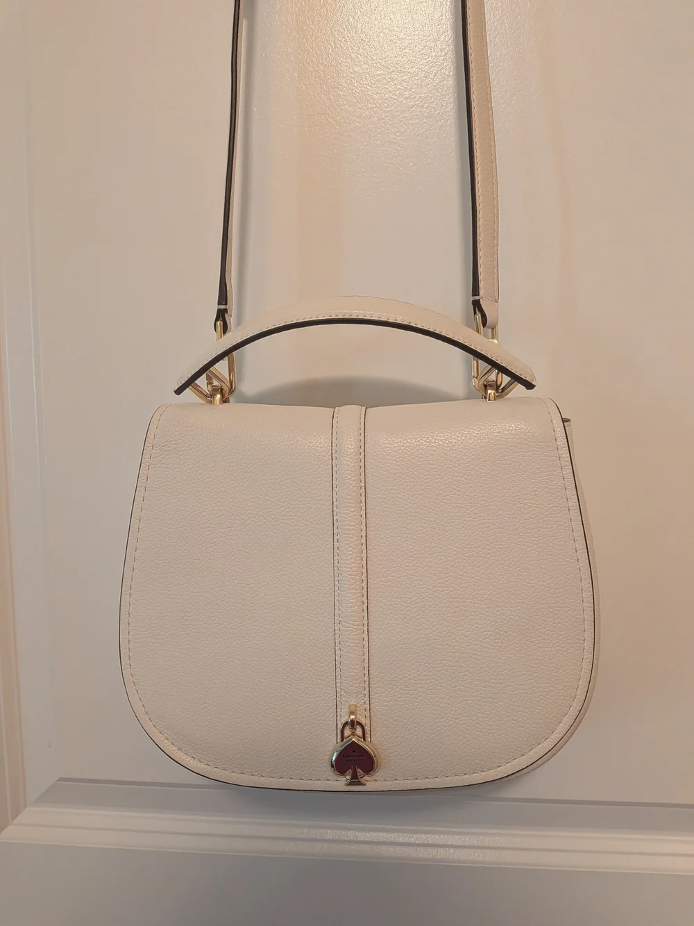 kate spade Cream Pebbled Leather Saddle Crossbody with Gold Heart Charm